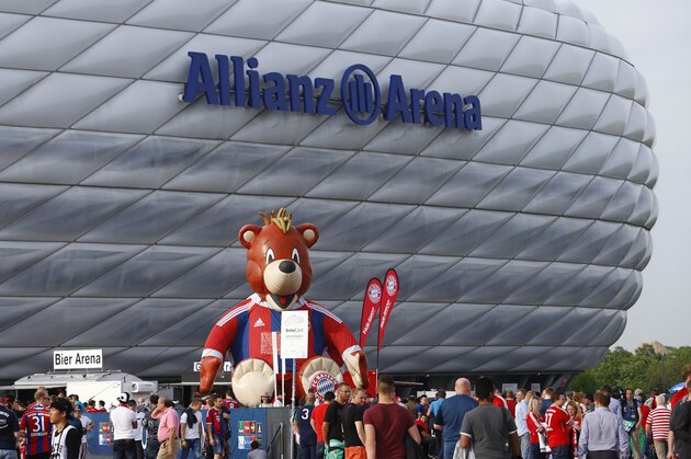 Fans arrive for the soccer Champions League second leg semifinal match between Bayern Munich and FC Barcelona at Allianz Arena in Munich, southern Germany, Tuesday, May 12, 2015. (AP Photo/Matthias Schrader)