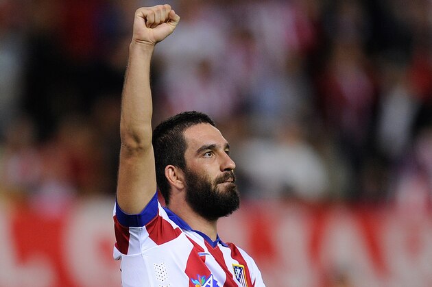 MADRID, SPAIN - OCTOBER 01:  Arda Turan of Club Atletico de Madrid celebrates after scoring his team's opening goal during the UEFA Champions League Group A match between Club Atletico de Madrid and Juventus at Vicente Calderon Stadium on October 1, 2014 in Madrid, Spain.  (Photo by Denis Doyle/Getty Images)