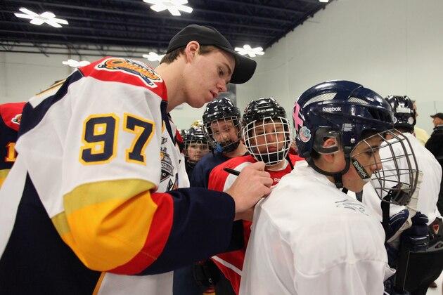 CORAL SPRINGS, FL - JUNE 25:  Connor McDavid signs autographs at the Top Prospects Clinic as part of the 2015 NHL Entry Draft Weekend at the Panthers Ice Den on June 25, 2015 in Coral Springs, Florida.  (Photo by Eliot J. Schechter/NHLI via Getty Images)