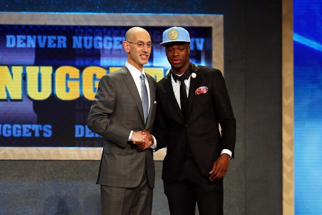 NEW YORK, NY - JUNE 25: Emmanuel Mudiay meets with Commissioner Adam Silver after being selected seventh overall by the Denver Nuggets in the First Round of the 2015 NBA Draft at the Barclays Center on June 25, 2015 in the Brooklyn borough of  New York City. NOTE TO USER: User expressly acknowledges and agrees that, by downloading and or using this photograph, User is consenting to the terms and conditions of the Getty Images License Agreement.  (Photo by Elsa/Getty Images)