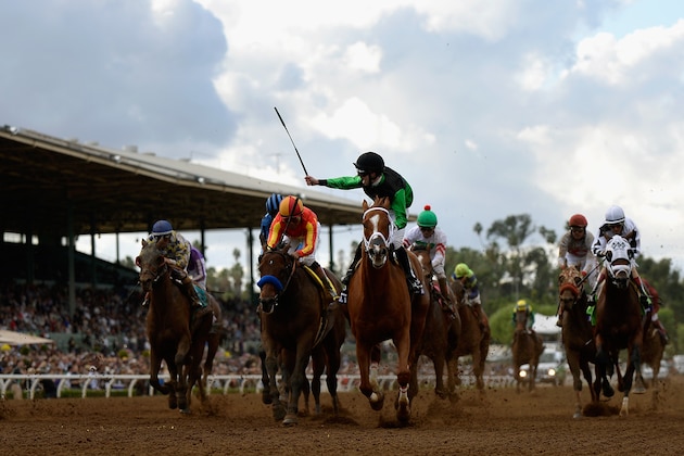ARCADIA, CA - NOVEMBER 01:  Jockey Florent Geroux celebrates as he crosses the finish line atop Work All Work in the 2014 Xpressbet Breeders' Cup Sprint at Santa Anita Park on November 1, 2014, in Arcadia, California.  (Photo by Kevork Djansezian/Getty Images)