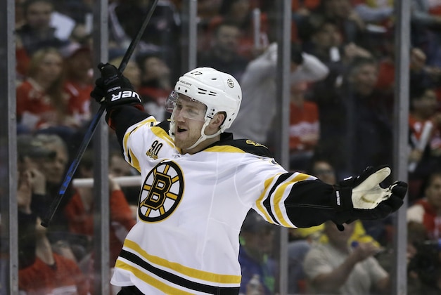 Boston Bruins defenseman Dougie Hamilton reacts after scoring during the first period of Game 3 of a first-round NHL hockey playoff series against the Detroit Red Wings in Detroit, Tuesday, April 22, 2014. (AP Photo/Carlos Osorio)