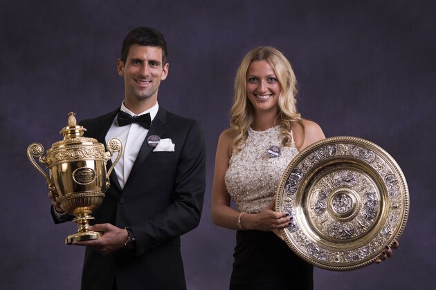 LONDON, ENGLAND - JULY 06:  Novak Djokovic of Serbia poses with the Gentlemen's Singles Trophy and Petra Kvitova of the Czech Republic poses with the Venus Rosewater Dish trophy at the Wimbledon Championships 2014 Winners Ball at The Royal Opera House on July 6, 2014 in London, England.   (Photo by Thomas Lovelock - Pool/AELTC/Getty Images)