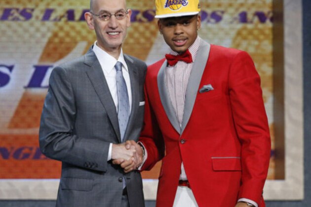 D’Angelo Russell, right, poses for a photo with NBA Commissioner Adam Silver after the Los Angeles Lakers selected Russell with the second pick during the NBA basketball draft, Thursday, June 25, 2015, in New York. (AP Photo/Kathy Willens)
