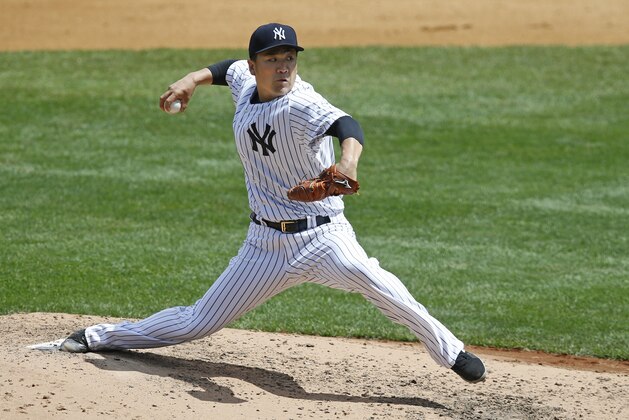 New York Yankees starting pitcher Masahiro Tanaka delivers in a baseball game against the Detroit Tigers at Yankee Stadium in New York, Sunday, June 21, 2015.  (AP Photo/Kathy Willens)