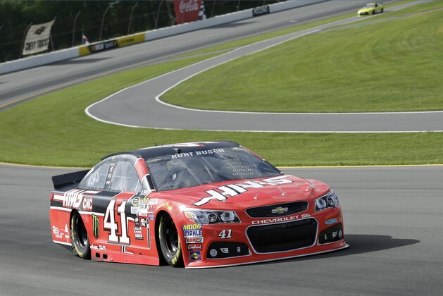 Kurt Busch (41) drives his race car at Pocono Raceway during qualifying for Sunday's NASCAR Sprint Cup Series auto race in Long Pond, Pa., Friday, June 5, 2015. Busch qualified on the pole. (AP Photo/Mel Evans)