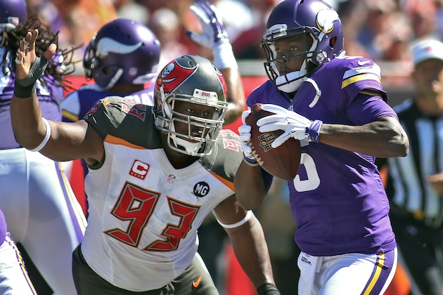 Tampa Bay Buccaneers defensive tackle Gerald McCoy (93) pressures Minnesota Vikings quarterback Teddy Bridgewater (5) during the second quarter of an NFL football game Sunday, Oct. 26, 2014, in Tampa, Fla. (AP Photo/Reinhold Matay)