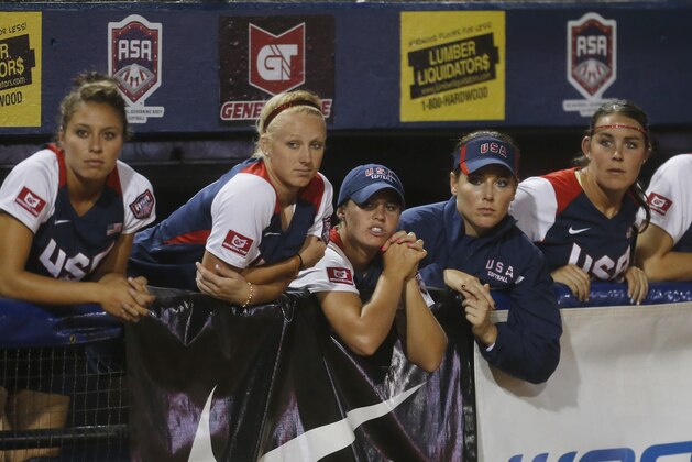 United States players watch from the dugout in the seventh inning of the World Cup of Softball tournament championship game against Japan in Oklahoma City, Sunday, July 14, 2013. Japan won 6-3. (AP Photo/Sue Ogrocki) United States players watch from the dugout in the seventh inning of the World Cup of Softball tournament championship game against Japan in Oklahoma City, Sunday, July 14, 2013. Japan won 6-3. (AP Photo/Sue Ogrocki)