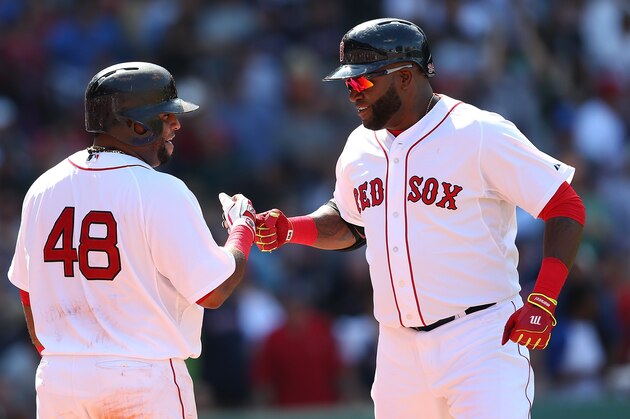 BOSTON, MA - JUNE 13:  David Ortiz #34 of the Boston Red Sox (R) celebrates with Pablo Sandoval #48 after hitting a home run against the Toronto Blue Jays in the sixth inning at Fenway Park on June 13, 2015 in Boston, Massachusetts.  (Photo by Jim Rogash/Getty Images)