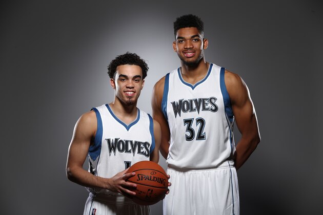 MINNEAPOLIS, MN - June 26:  The first overall pick of the 2015 NBA Draft, Karl-Anthony Towns and 22nd pick Tyus Jones of the Minnesota Timberwolves pose for portraits on June 26, 2015 at the Minnesota Timberwolves and Lynx Courts at Mayo Clinic Square in Minneapolis, Minnesota.  NOTE TO USER:  User expressly acknowledges and agrees that, by downloading and or using this Photograph, user is consenting to the terms and conditions of the Getty Images License Agreement. Mandatory Copyright Notice: Copyright 2015 NBAE (Photo by David Sherman/NBAE via Getty Images)