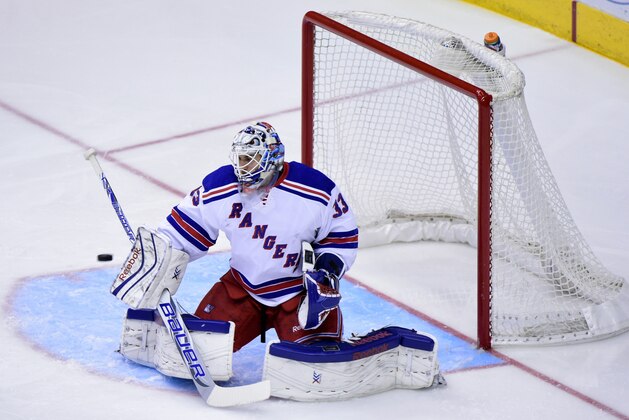 Feb 14, 2015; Glendale, AZ, USA; New York Rangers goalie Cam Talbot (33) makes a save during the first period against the Arizona Coyotes at Gila River Arena. Mandatory Credit: Matt Kartozian-USA TODAY Sports