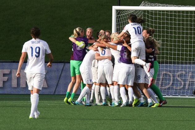OTTAWA, ON - JUNE 22: Karen Bardsley #1 and Karen Carney #10 of England celebrate their team's win with team mates after the FIFA Women's World Cup Canada 2015 round of 16 match between Norway and England at Lansdowne Stadium on June 22, 2015 in Ottawa, Canada.  (Photo by Andre Ringuette/Getty Images)