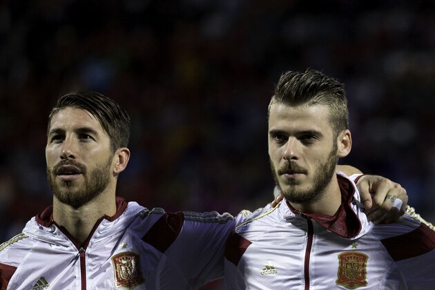 LEON, SPAIN - JUNE 11: Goalkeeper David de Gea (R) of Spain listen to the Spanish national anthem embraced to his teammate Sergio Ramos (R) during the international friendly match between Spain and Costa Rica at Reino de Leon Stadium on June 11, 2015 in Leon, Spain.  (Photo by Gonzalo Arroyo Moreno/Getty Images)