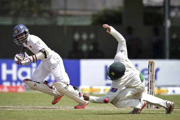 Sri Lanka's Kaushal Silva, left, takes off for a run as Pakistan's Azhar Ali tries to catch the ball during the second day of the second test cricket match between Sri Lanka and Pakistan in Colombo, Sri Lanka Friday, June 26, 2015. (AP Photo/Sanka Gayashan) Sri Lanka's Kaushal Silva, left, takes off for a run as Pakistan's Azhar Ali tries to catch the ball during the second day of the second test cricket match between Sri Lanka and Pakistan in Colombo, Sri Lanka Friday, June 26, 2015. (AP Photo/Sanka Gayashan)