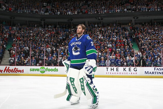 VANCOUVER, BC - APRIL 15:  Eddie Lack #31 of the Vancouver Canucks listens to the national anthem during Game One of the Western Conference Quarterfinals of the 2015 NHL Stanley Cup Playoffs against the Calgary Flames at Rogers Arena on April 15, 2015 in Vancouver, British Columbia, Canada. Calgary won 2-1. (Photo by Jeff Vinnick/NHLI via Getty Images)
