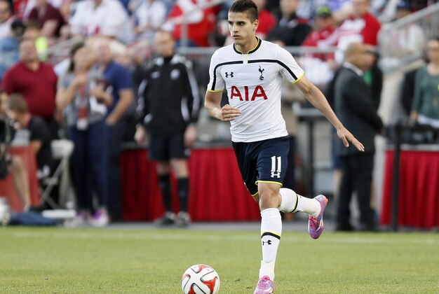 Jul 23, 2014; Toronto, Ontario, Canada; Tottenham Hotspur midfielder Erik Lamela (11) carries the ball against Toronto FC at BMO Field. Tottenham defeated Toronto 3-2. Mandatory Credit: John E. Sokolowski-USA TODAY Sports