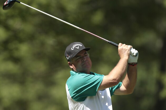 Kenny Perry watches his tee shot on the ninth hole during the Champions Tour's Regions Tradition golf tournament at Shoal Creek Country Club, Thursday, May 14, 2015, in Birmingham, Ala. (AP Photo/Butch Dill)