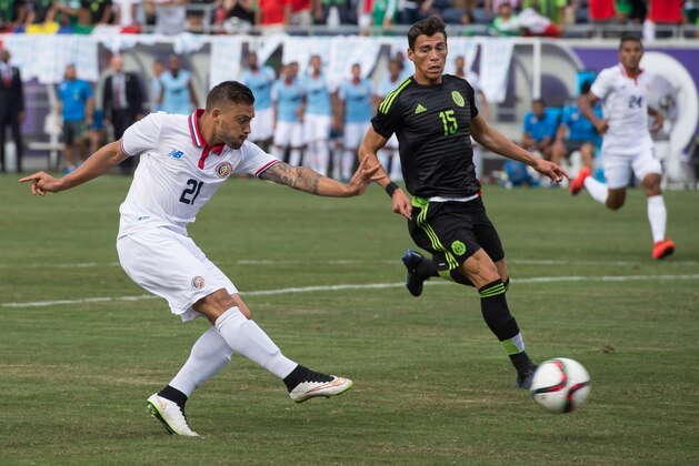 Jun 27, 2015; Orlando, FL, USA; Costa Rica forward David Ramirez (21) scores a goal against Mexico during the first half at the Orlando Citrus Bowl. Mandatory Credit: Jerome Miron-USA TODAY Sports