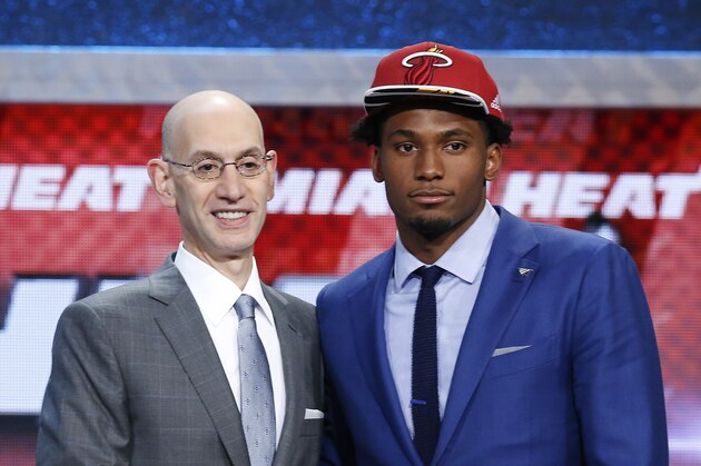 Justise Winslow, right, poses for a photo with NBA Commissioner Adam Silver after being selected 10th overall by the Miami Heat during the NBA basketball draft, Thursday, June 25, 2015, in New York. (AP Photo/Kathy Willens)