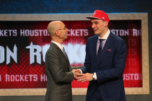 Jun 25, 2015; Brooklyn, NY, USA; Sam Dekker (Wisconsin) greets NBA commissioner Adam Silver after being selected as the number eighteen overall pick to the Houston Rockets in the first round of the 2015 NBA Draft at Barclays Center. Mandatory Credit: Brad Penner-USA TODAY Sports