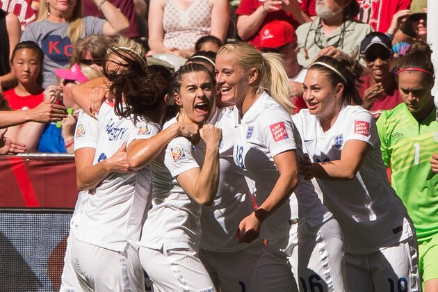 VANCOUVER, BC - JUNE 27: Claire Rafferty #3 of England celebrates team mate Lucy Bronze's #12 (not pictured) goal against Canada walks during the FIFA Women's World Cup Canada 2015 Quarter Final match between the England and Canada June, 27, 2015 at BC Place Stadium in Vancouver, British Columbia, Canada. Claire Rafferty #3, Katie Chapman #16 and Jodie Taylor #19 of England join the celebration.  (Photo by Rich Lam/Getty Images)