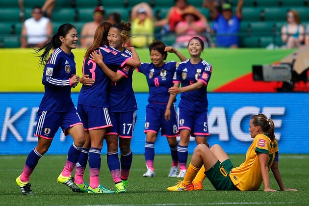 EDMONTON, AB - JUNE 27:  Homare Sawa #10, Rumi Utsugi #13 and Yuki Ogimi #17 of Japan celebrate their 1-0 win over Australia in the FIFA Women's World Cup Canada 2015 Quarter Final match between Australia and Japan at Commonwealth Stadium on June 27, 2015 in Edmonton, Canada.  (Photo by Kevin C. Cox/Getty Images)