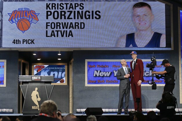 Kristaps Porzingis, right, poses for a photo with NBA Commissioner Adam Silver after being selected fourth overall by the New York Knicks during the NBA basketball draft, Thursday, June 25, 2015, in New York.(AP Photo/Julie Jacobson)