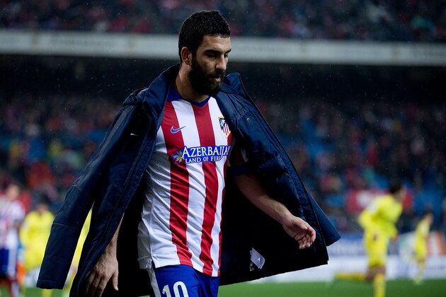 MADRID, SPAIN - DECEMBER 14: Arda Turan of Atletico de Madrid leaves the picth during the La Liga match between Club Atletico de Madrid and Villarreal CF at Vicente Calderon Stadium on December 14, 2014 in Madrid, Spain.  (Photo by Gonzalo Arroyo Moreno/Getty Images)
