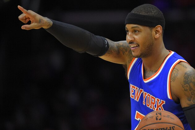 New York Knicks forward Carmelo Anthony points toward the Los Angeles Clippers during the first half of an NBA basketball game against the Clippers, Wednesday, Dec. 31, 2014, in Los Angeles. (AP Photo/Mark J. Terrill)