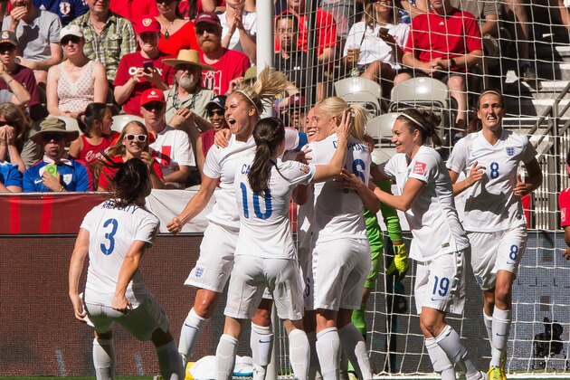VANCOUVER, BC - JUNE 27: Fara Williams #4 of England celebrates team mate Lucy Bronze's #12 (not pictured) goal against Canada with teammates during the FIFA Women's World Cup Canada 2015 Quarter Final match between the England and Canada June, 27, 2015 at BC Place Stadium in Vancouver, British Columbia, Canada.  (Photo by Rich Lam/Getty Images)
