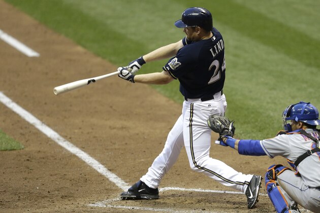 MILWAUKEE, WI - JUNE 24: Adam Lind #24 of the Milwaukee Brewers hits a single in the fifth inning against the New York Mets during the game against the Milwaukee Brewers at Miller Park on June 24, 2015 in Milwaukee, Wisconsin. (Photo by Mike McGinnis/Getty Images)
