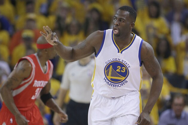 Golden State Warriors forward Draymond Green (23) reacts after making a three point basket against the Houston Rockets during the first half of Game 2 of the NBA basketball Western Conference finals in Oakland, Calif., Thursday, May 21, 2015. (AP Photo/Rick Bowmer)