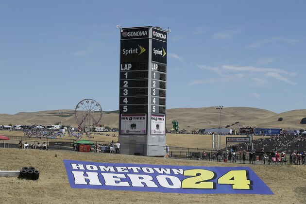 A tribute to Jeff Gordon is seen above turn one during the NASCAR Sprint Cup Series auto race Sunday, June 28, 2015, in Sonoma, Calif. (AP Photo/Eric Risberg)