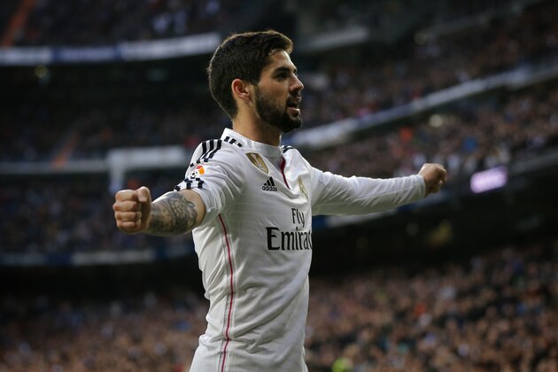 Real Madrid’s Isco, right, celebrates after scoring a goal during a Spanish La Liga soccer match between Real Madrid and Deportivo La Coruna at the Santiago Bernabeu stadium in Madrid, Spain, Saturday, Feb. 14, 2015. (AP Photo/Daniel Ochoa de Olza)