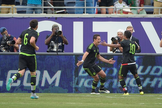 Mexico forward Javier Hernandez (14) is congratulated by forward Giovani Dos Santos (10) and midfielder Hector Herrera (6) after scoring a goal during the second half of a friendly soccer match against Costa Rica in Orlando, Fla., Saturday, June 27, 2015. The teams tied 2-2. (AP Photo/Phelan M. Ebenhack) Mexico forward Javier Hernandez (14) is congratulated by forward Giovani Dos Santos (10) and midfielder Hector Herrera (6) after scoring a goal during the second half of a friendly soccer match against Costa Rica in Orlando, Fla., Saturday, June 27, 2015. The teams tied 2-2. (AP Photo/Phelan M. Ebenhack)