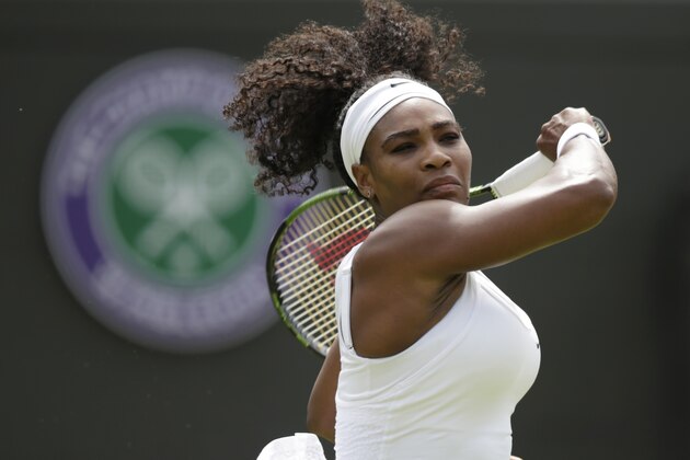 Serena Williams of the United States plays a return to Margarita Gasparyan of Russia during the women's singles first round match at the All England Lawn Tennis Championships in Wimbledon, London, Monday June 29, 2015. (AP Photo/Pavel Golovkin)
