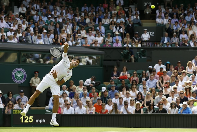 Novak Djokovic of Serbia serves to Philipp Kohlschreiber of Germany during the men's singles first round match at the All England Lawn Tennis Championships in Wimbledon, London, Monday June 29, 2015. (AP Photo/Kirsty Wigglesworth)