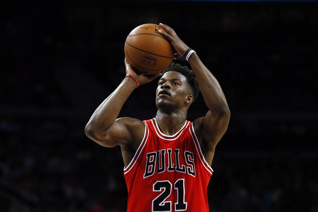 Chicago Bulls guard Jimmy Butler (21) shoots against the Detroit Pistons in the second half of an NBA basketball game in Auburn Hills, Mich., Friday, Feb. 20, 2015. (AP Photo/Paul Sancya)
