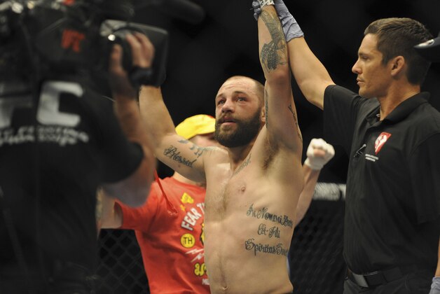 May 24, 2014; Las Vegas, NV, USA; Sam Sicilia celebrates his win by unanimous decision against Aaron Phillips (not pictured) after their UFC 173 featherweight bout at MGM Grand Garden Arena. Mandatory Credit: Stephen R. Sylvanie-USA TODAY Sports May 24, 2014; Las Vegas, NV, USA; Sam Sicilia celebrates his win by unanimous decision against Aaron Phillips (not pictured) after their UFC 173 featherweight bout at MGM Grand Garden Arena. Mandatory Credit: Stephen R. Sylvanie-USA TODAY Sports