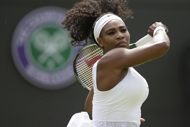 Serena Williams of the United States plays a return to Margarita Gasparyan of Russia during the women's singles first round match at the All England Lawn Tennis Championships in Wimbledon, London, Monday June 29, 2015. (AP Photo/Pavel Golovkin)