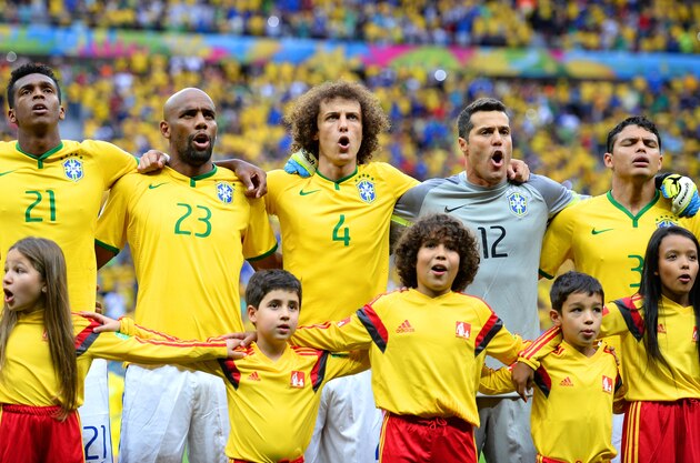 BRASILIA, BRAZIL - JULY 12:  Jo, Maicon, David Luiz, Julio Cesar and Thiago Silva of Brazil sing the National Anthem prior to during the 2014 FIFA World Cup Brazil Third Place Playoff match between Brazil and the Netherlands at Estadio Nacional on July 12, 2014 in Brasilia, Brazil.  (Photo by Jamie McDonald/Getty Images)