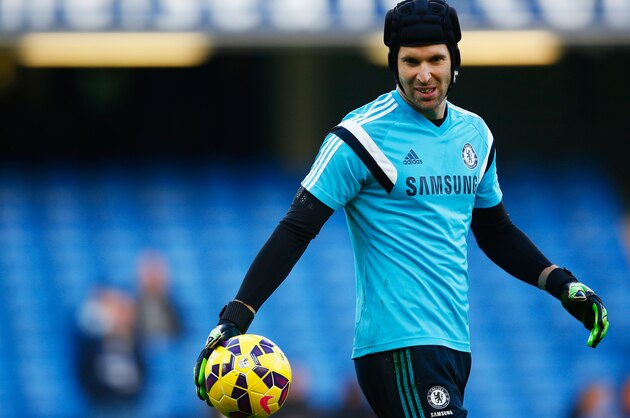 LONDON, ENGLAND - DECEMBER 13:  Goalkeeper Petr Cech of Chelsea warms up prior to the Barclays Premier League match between Chelsea and Hull City at Stamford Bridge on December 13, 2014 in London, England.  (Photo by Clive Rose/Getty Images)