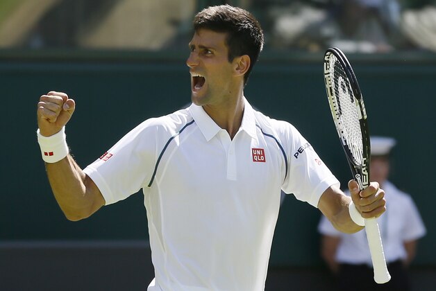 Novak Djokovic of Serbia celebrates defeating Philipp Kohlschreiber of Germany in their men's singles first round match at the All England Lawn Tennis Championships in Wimbledon, London, Monday June 29, 2015. Djokovic won the match 6-4, 6-4, 6-4. (AP Photo/Kirsty Wigglesworth)