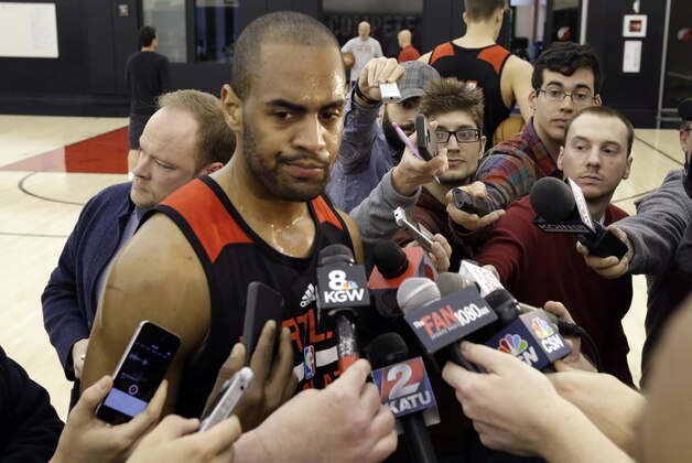Portland Trail Blazers guard Arron Afflalo talks with reporters after NBA basketball practice in Portland, Ore., Friday, April 24, 2015. The Memphis Grizzlies lead the Trail Blazers 2-0 in their first round series heading into Saturday's Game 3 in Portland. Afflalo will play in Saturday's game after sitting out the first two games because of a right shoulder injury. (AP Photo/Don Ryan)