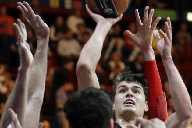FILE - In this May 18, 2014, file photo, Barcelona’s Mario Hezonja shoots during the Euroleague Final Four third place basketball match between Barcelona and CSKA of Moscow in Milan, Italy.  (AP Photo/Luca Bruno, File)
