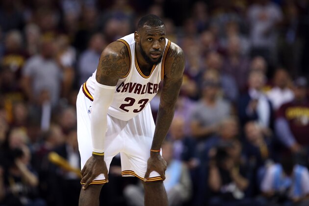 CLEVELAND, OH - JUNE 16:  LeBron James #23 of the Cleveland Cavaliers reacts against the Golden State Warriors during Game Six of the 2015 NBA Finals at Quicken Loans Arena on June 16, 2015 in Cleveland, Ohio. NOTE TO USER: User expressly acknowledges and agrees that, by downloading and or using this photograph, user is consenting to the terms and conditions of Getty Images License Agreement.  (Photo by Ezra Shaw/Getty Images)