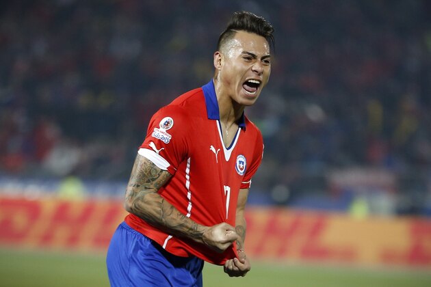 Chile's Eduardo Vargas, right, celebrates after scoring against Peru during a Copa America semifinal soccer match at the National Stadium in Santiago, Chile, Monday, June 29, 2015. (AP Photo/Andre Penner)