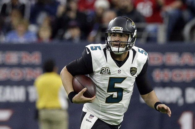 Jacksonville Jaguars quarterback Blake Bortles (5) runs with the ball during the first half of an NFL football game against the Houston Texans Sunday, Dec. 28, 2014, in Houston. (AP Photo/Patric Schneider)