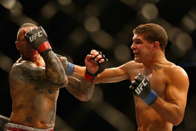 SYDNEY, AUSTRALIA - NOVEMBER 08:  Ross Pearson of England is hit with a right hand by Al Iaquinta of the USA in their lightweight fight during the UFC Fight Night 55 event at Allphones Arena on November 8, 2014 in Sydney, Australia.  (Photo by Mark Kolbe/Getty Images)