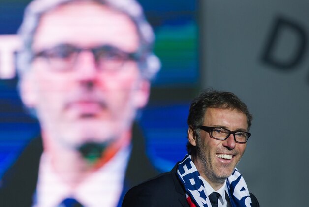PSG coach  Laurent Blanc  celebrate their French League One title at the Parc des Princes stadium in Paris, Saturday, May 23, 2015. Paris Saint-Germain clinched a third straight title. (AP Photo/Kamil Zihnioglu)